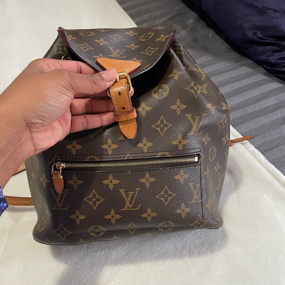 Louis Vuitton brown monogram montsouris backpack in used condition.